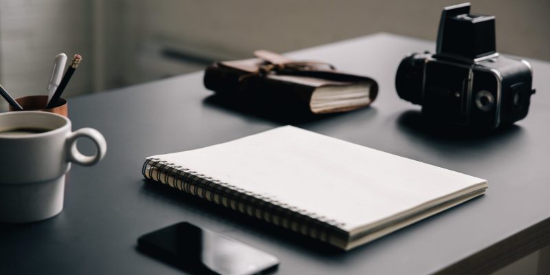 blank-notebook-on-creative-workspace